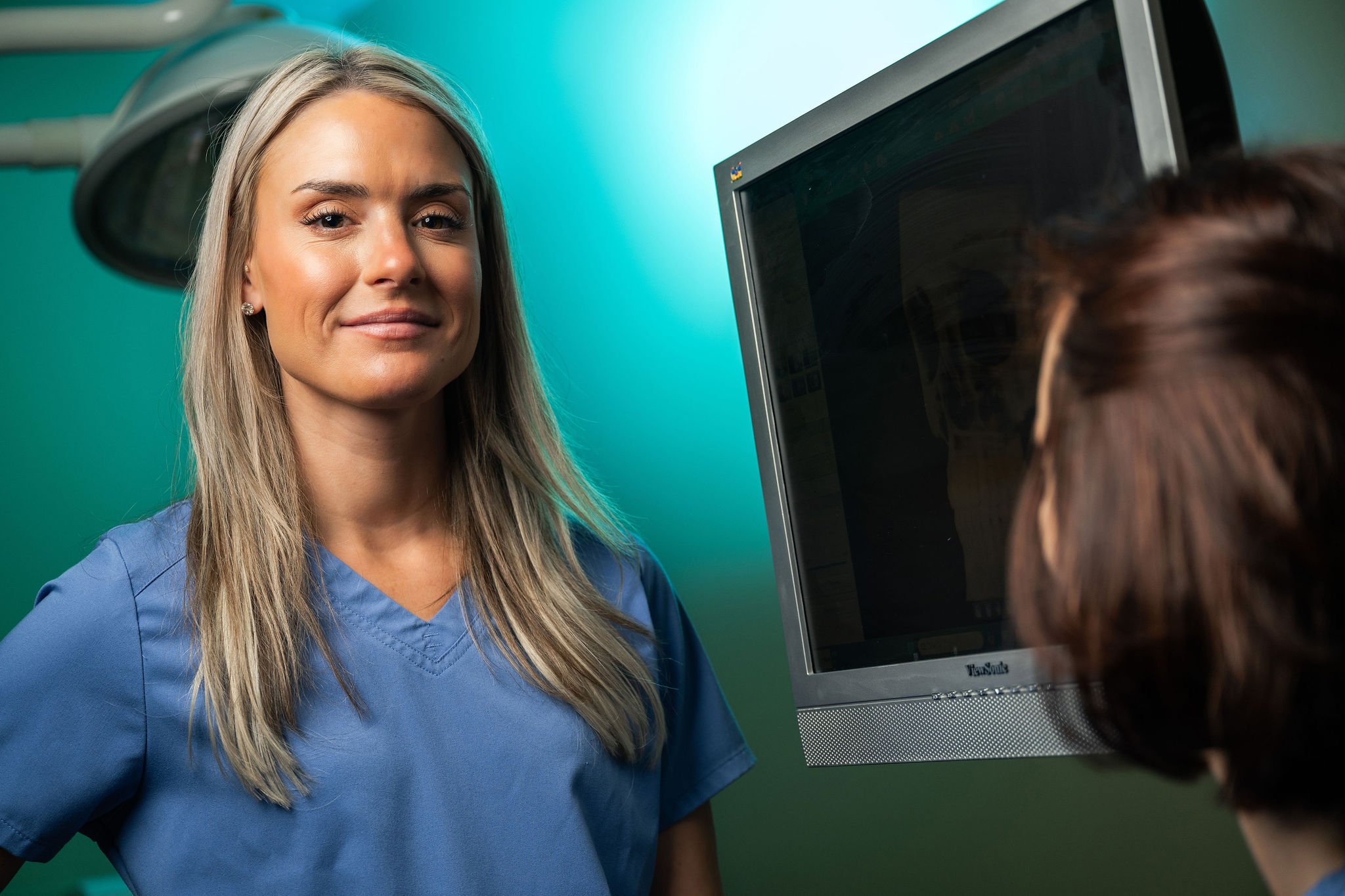 Dr. Haigney with jaw model explaining procedure